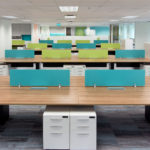Hong Lam Marine Offices, open plan offices with hues of green and blue, provide a contemporary spacious interior and increase communication. Central filing reduces clutter and improves efficiency.