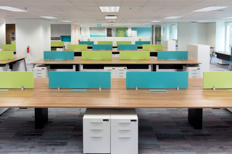 Hong Lam Marine Offices, open plan offices with hues of green and blue, provide a contemporary spacious interior and increase communication. Central filing reduces clutter and improves efficiency.