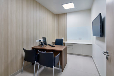Pacific Fertility Institutes Clinic. Consultation rooms incorporate a natural look feature wall which wraps around 3 sides of the room. These rooms are designed for treatment consultation. Similar rooms are provided for examination with an attached ultrasound room.