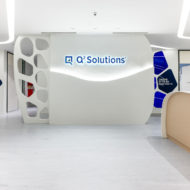 Q2 Solutions visitor reception for the offices and laboratories in Singapore. The interior design uses a thematic device to link areas and provide unity. 'Pursuits' creates flowing lines and white spaces. The sub-theme 'discovery' gives rise to the introduction of bold colours in key client facing areas.
